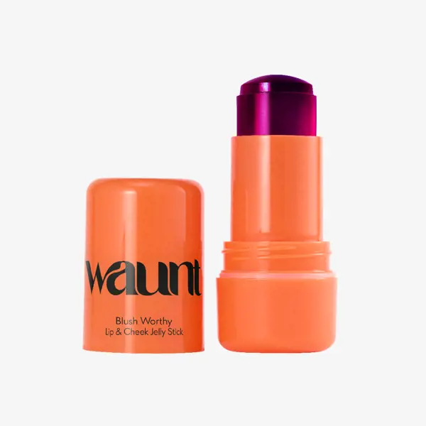 pomarańczowa tubka z fioletową nakrętką