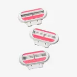 a group of pink and white razors