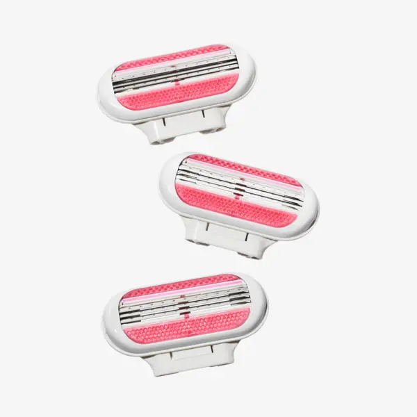 a group of pink and white razors