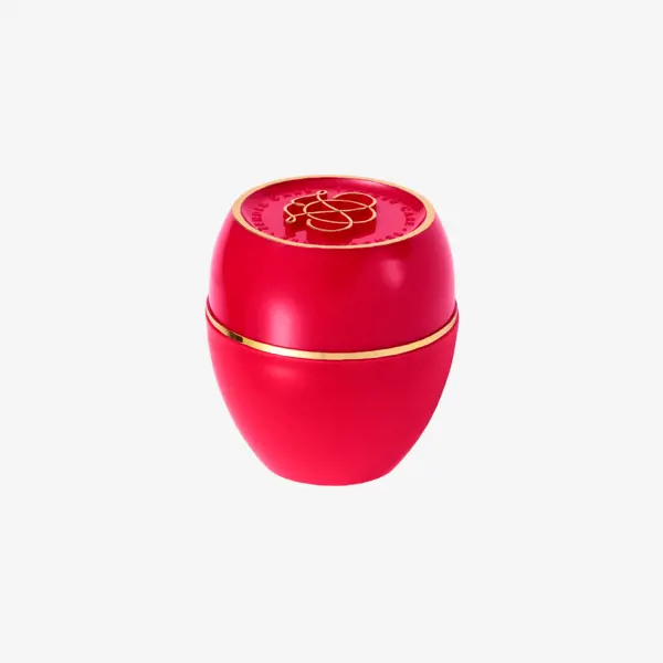 un flacon rouge avec un logo doré
