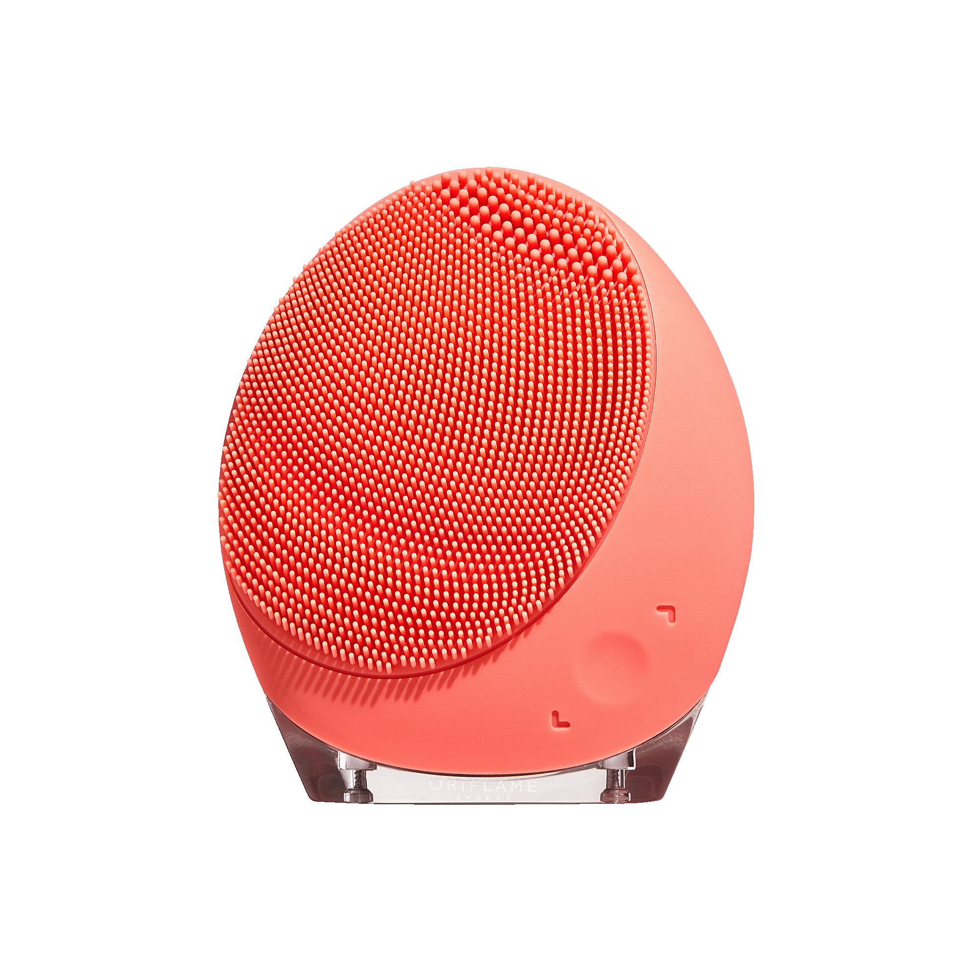 a red facial brush on a stand