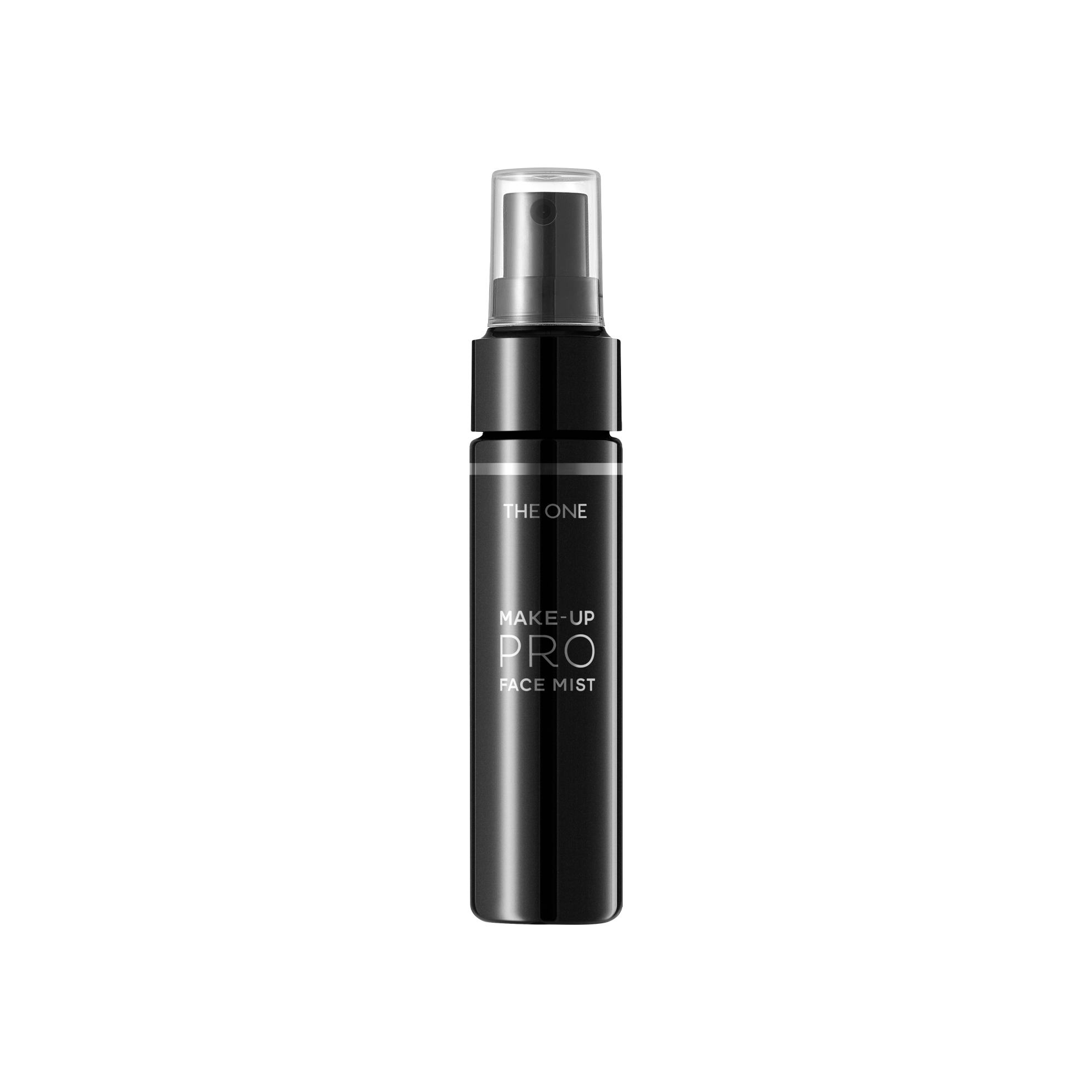 a black bottle of make up pro face mist with Willis Tower in the background