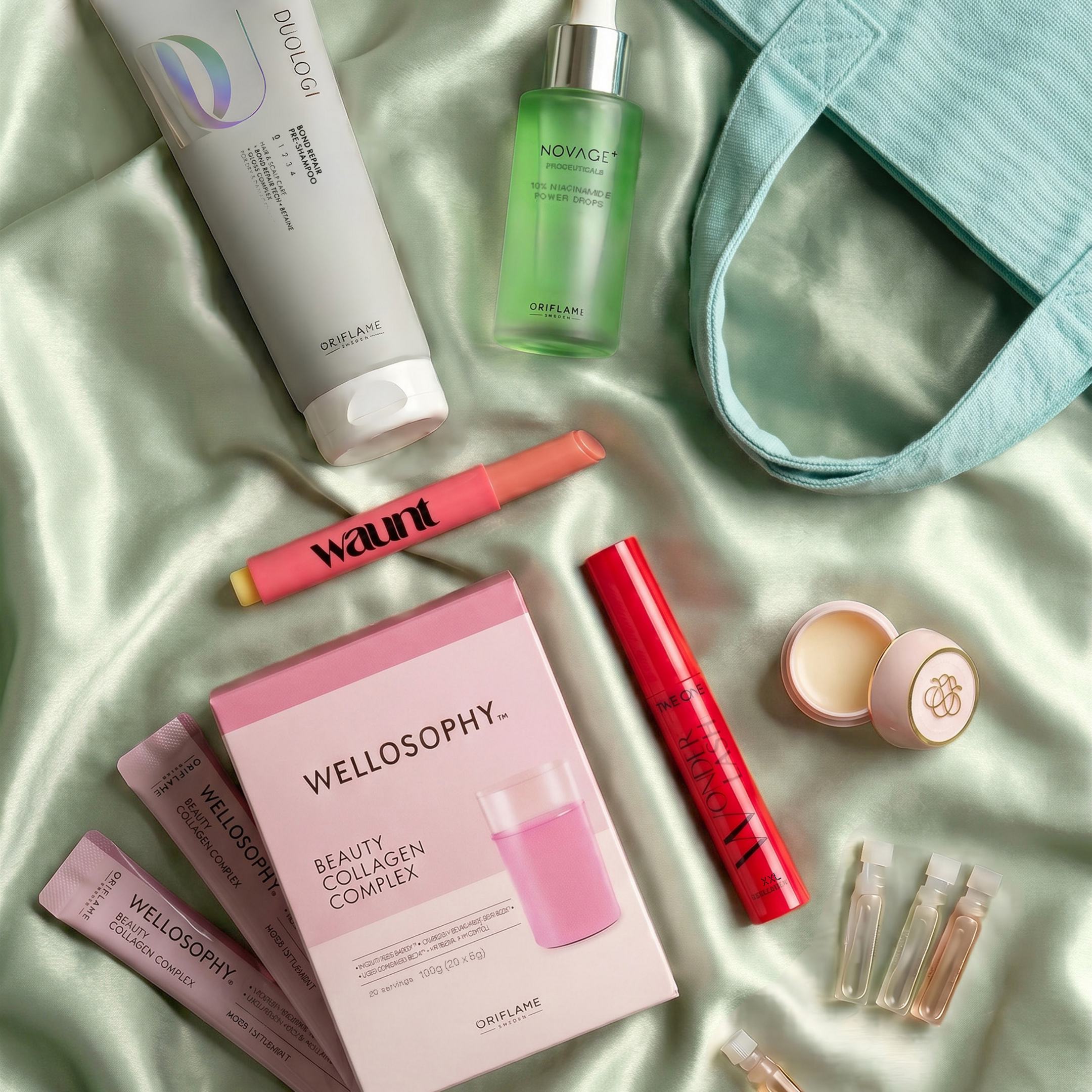 a group of cosmetics on a green fabric