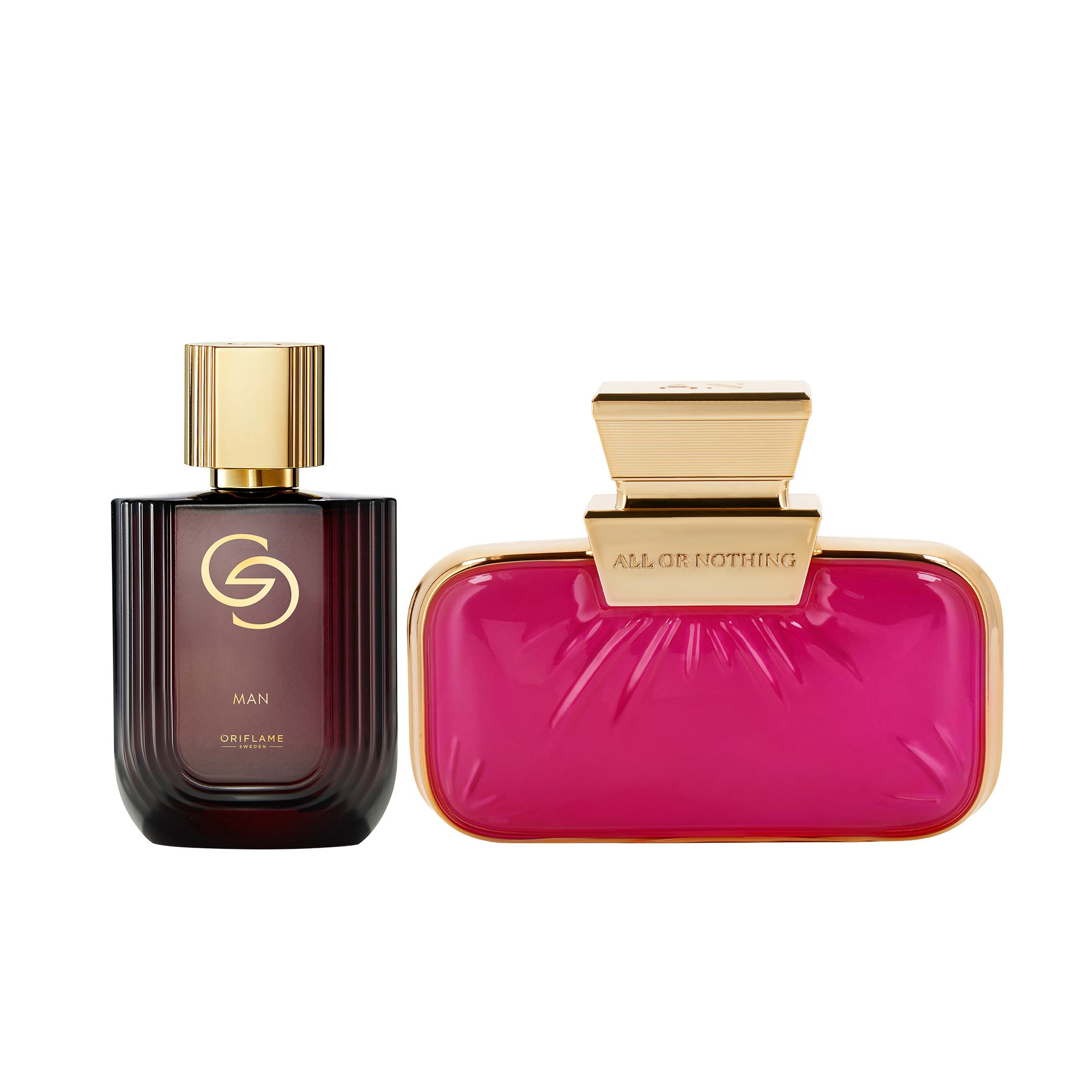 sebotol parfum di samping tas berwarna pink