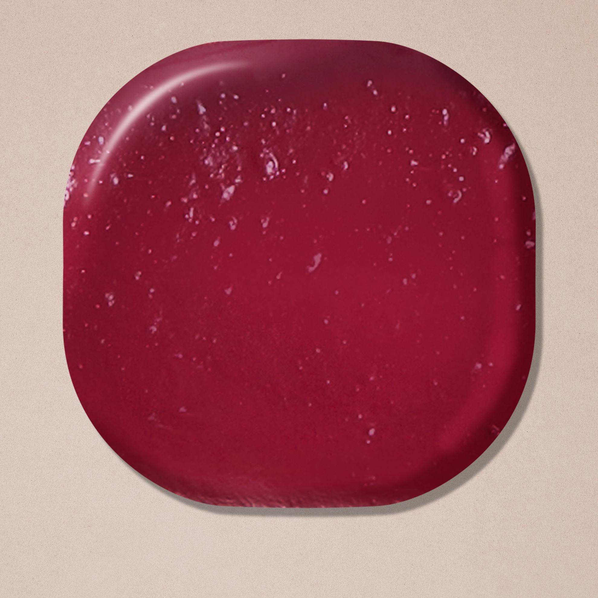 a red square object with white specks