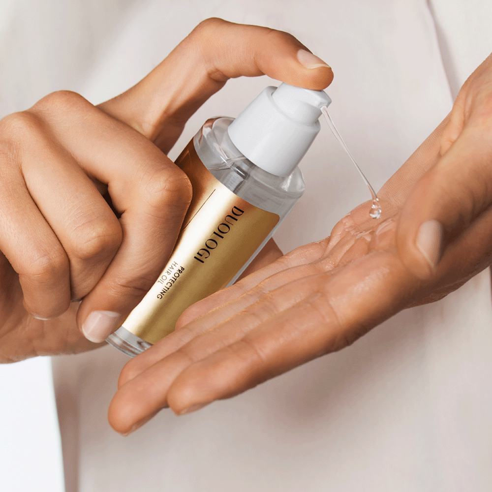 a person using a bottle of liquid