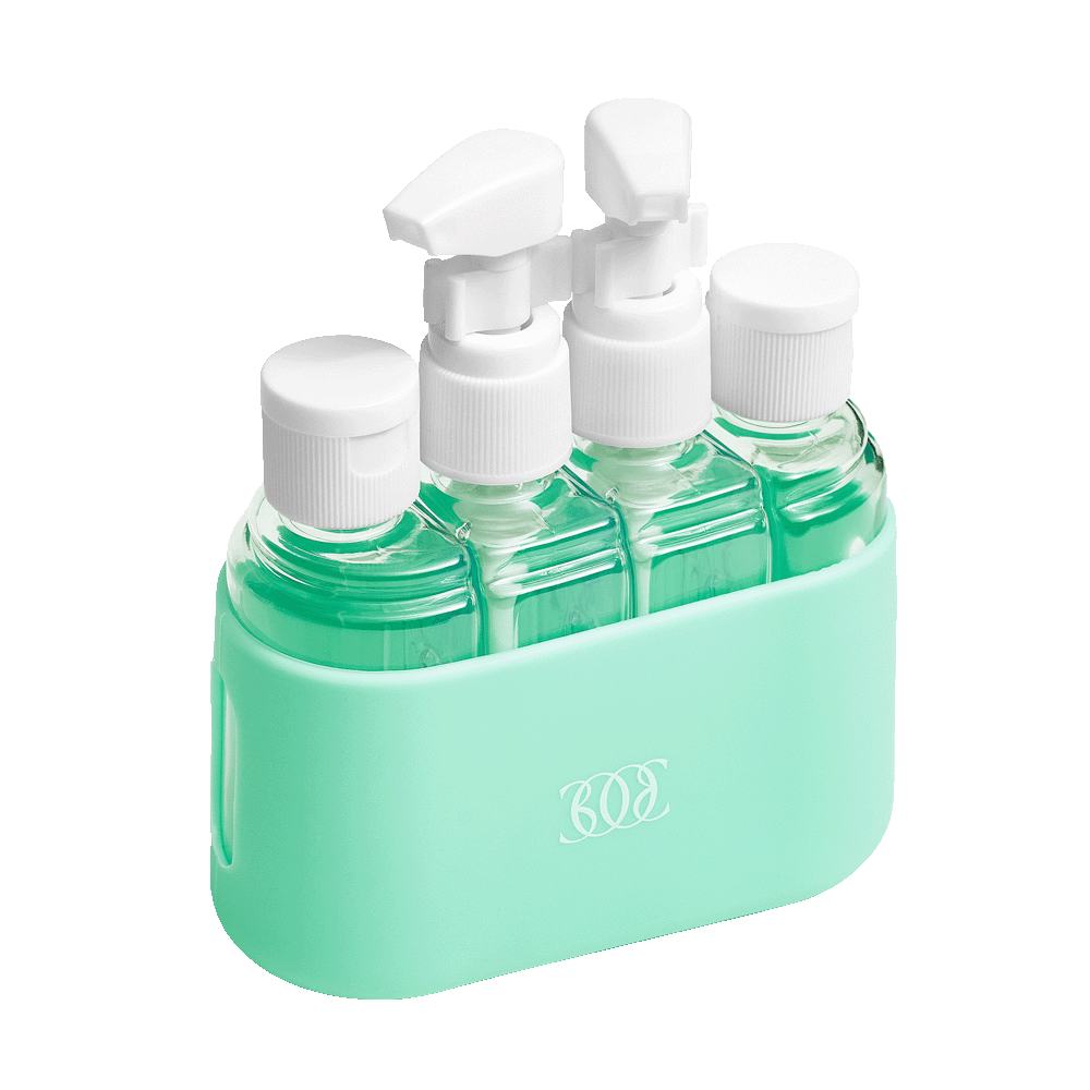 a group of bottles with green liquid in a holder