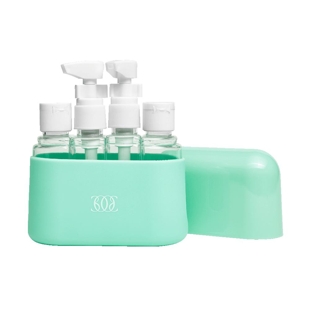 a group of small bottles in a green case