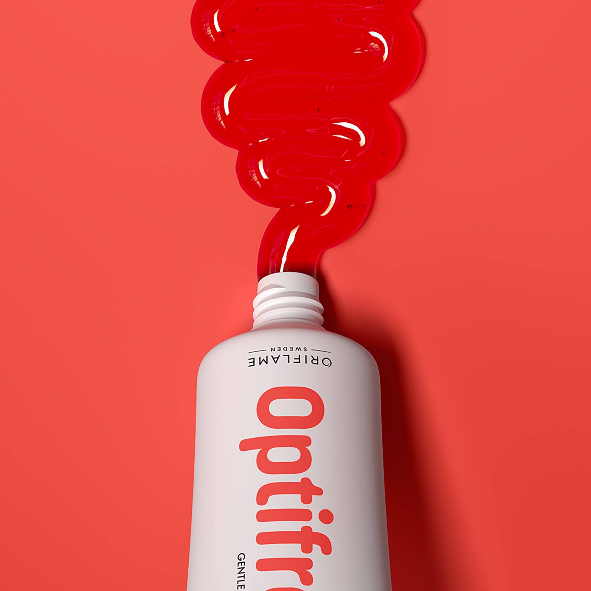 a white bottle with red liquid pouring out of it