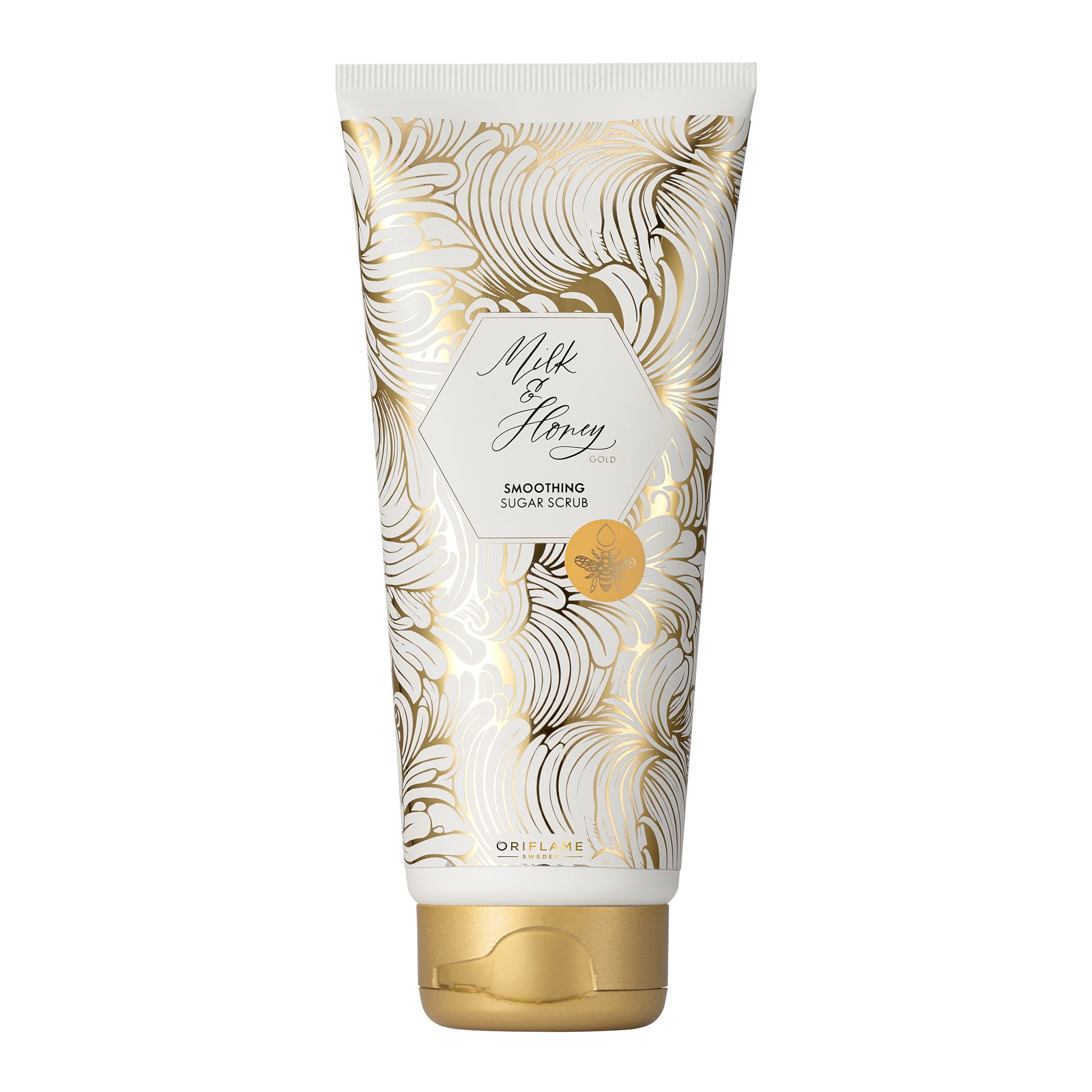 a white and gold tube with gold designs