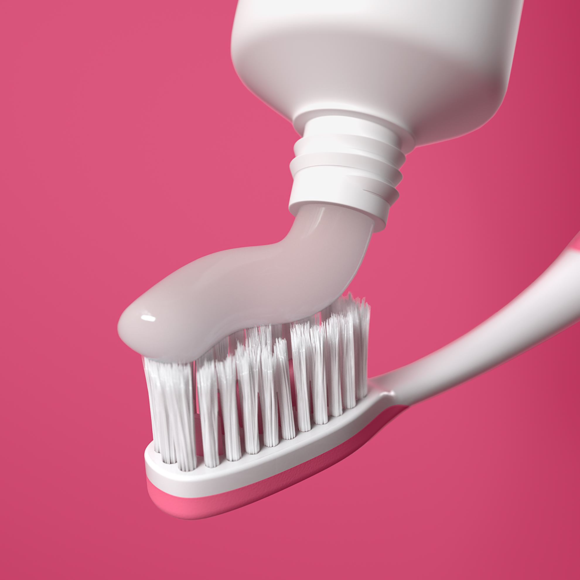 a toothpaste being applied to a toothbrush