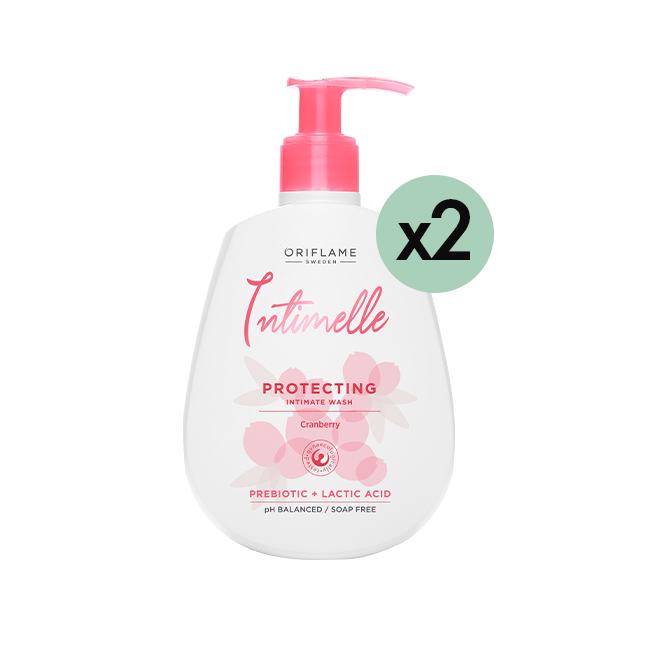 una botella blanca con etiqueta rosa